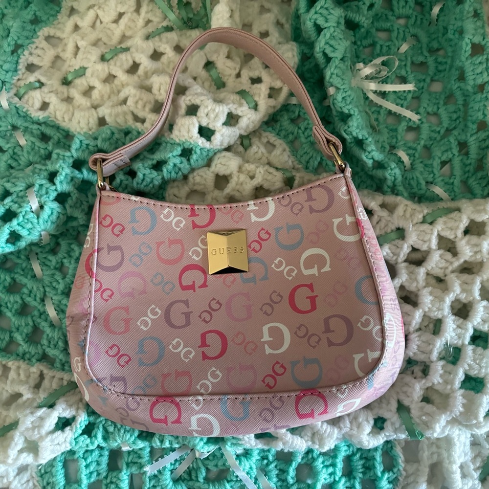 Brand new Guess mini hand purse with crossbody gold strap included